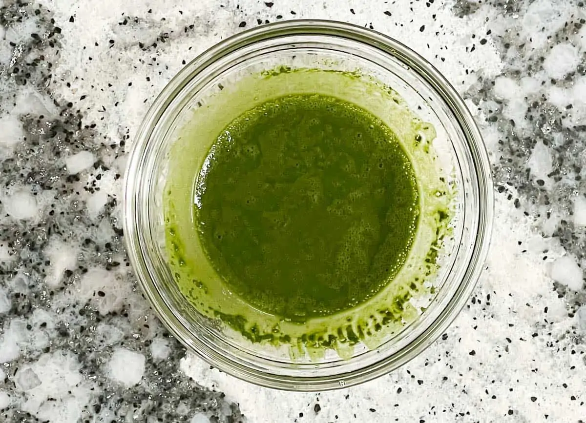 Matcha powder and water whisked together. 