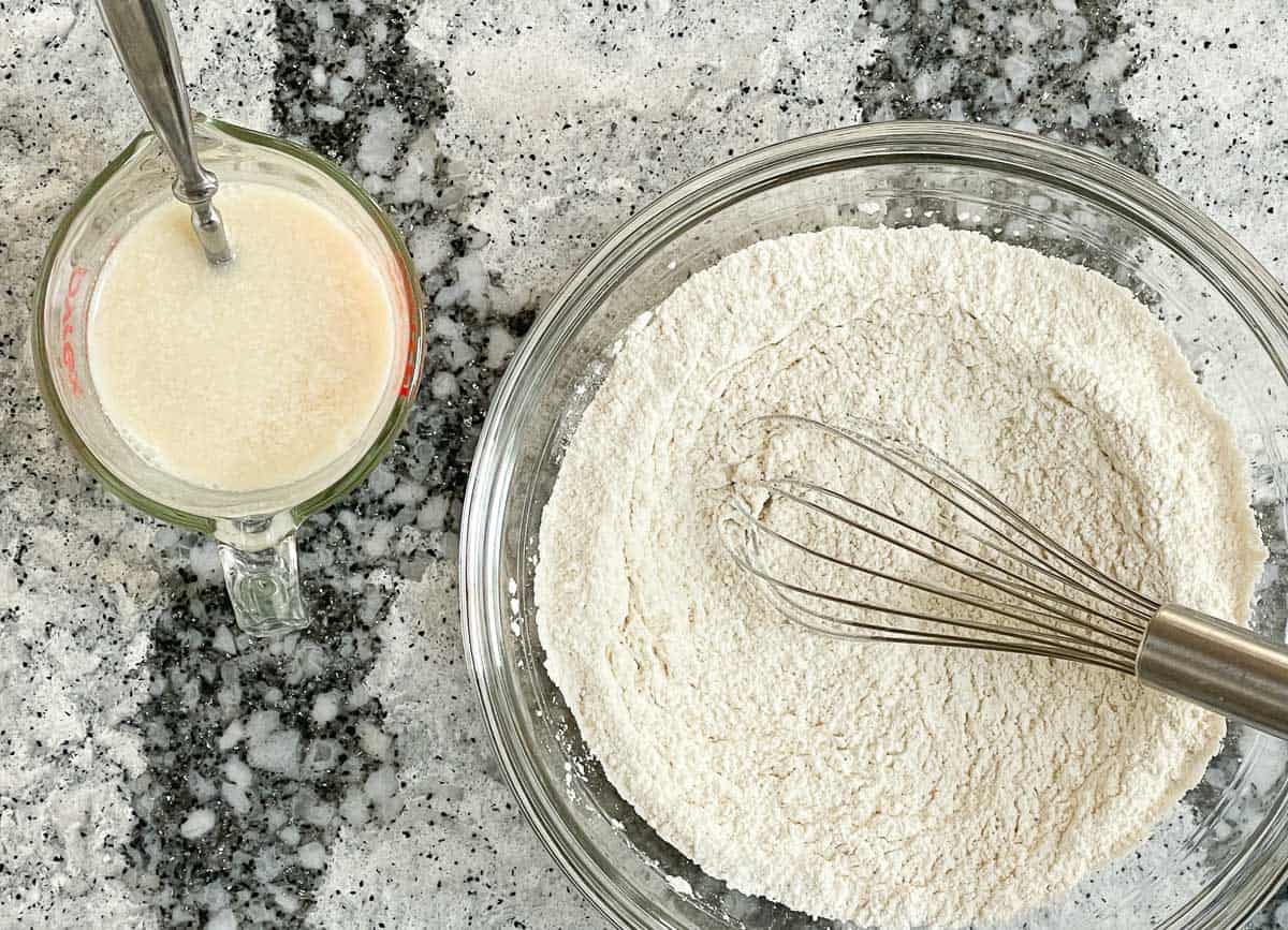 Vegan buttermilk and flour in glass bowl. 