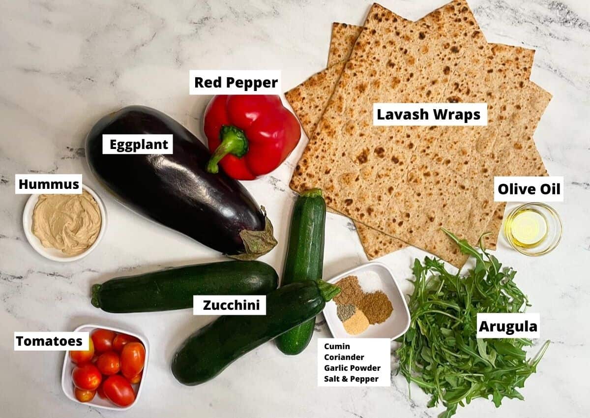 Lavash Wrap Sandwich Ingredients: lavash wraps, olive oil, arugula, spices, zucchini, tomatoes, red pepper, eggplant, hummus. 
