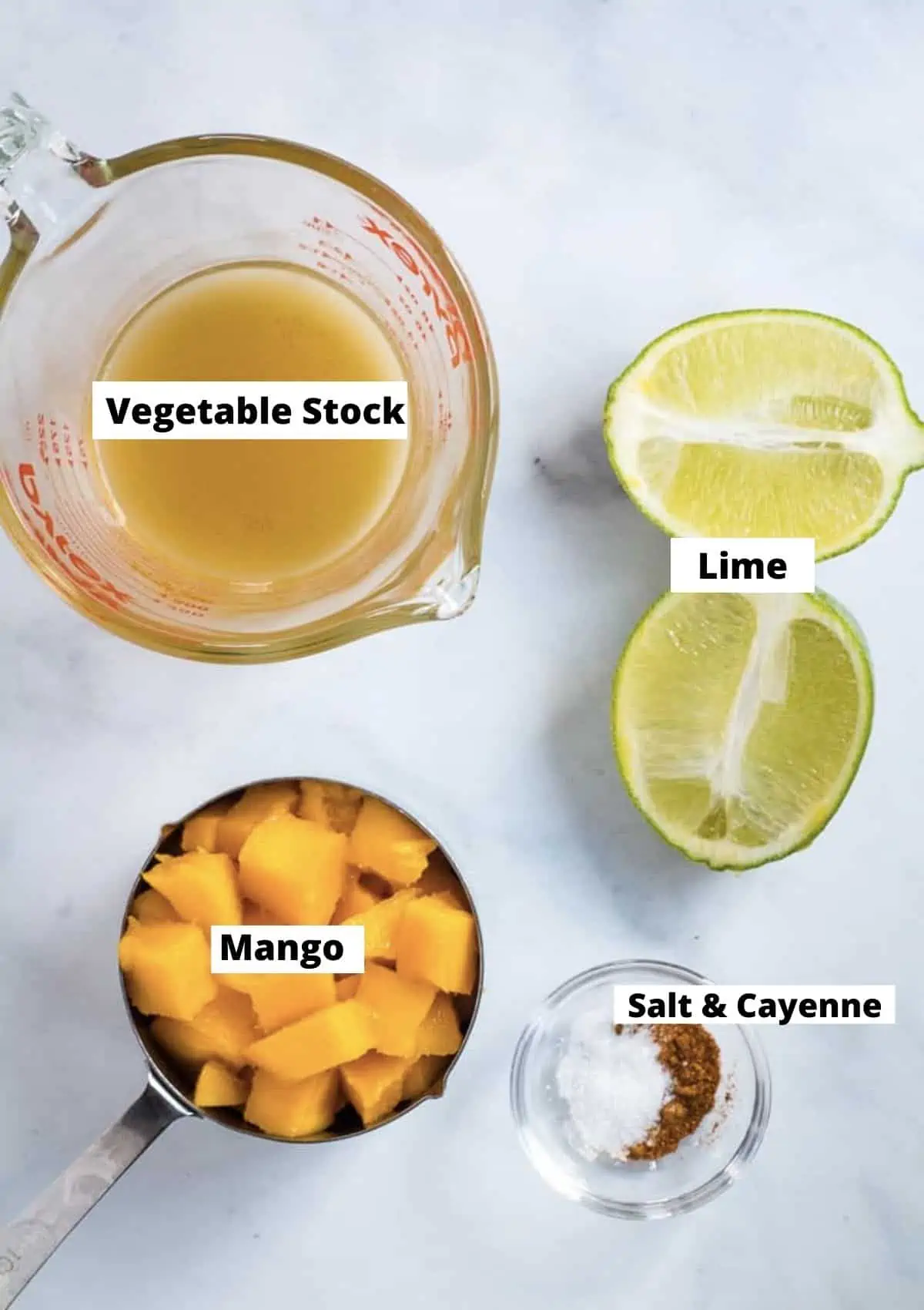 Mango Dressing Ingredients: vegetable stock, lime, mango chunks, salt, and cayenne.