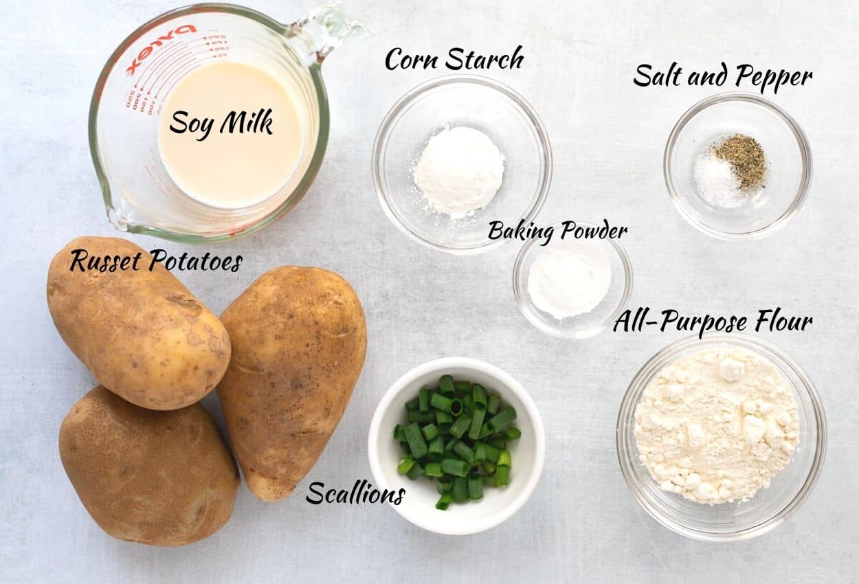Ingredients for Vegan Latkes: russet potatoes, soy milk, corn starch, salt, pepper, flour, baking powder, and scallions. 