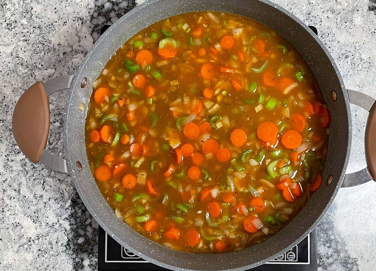 Vegetable stock added to split pea soup. 