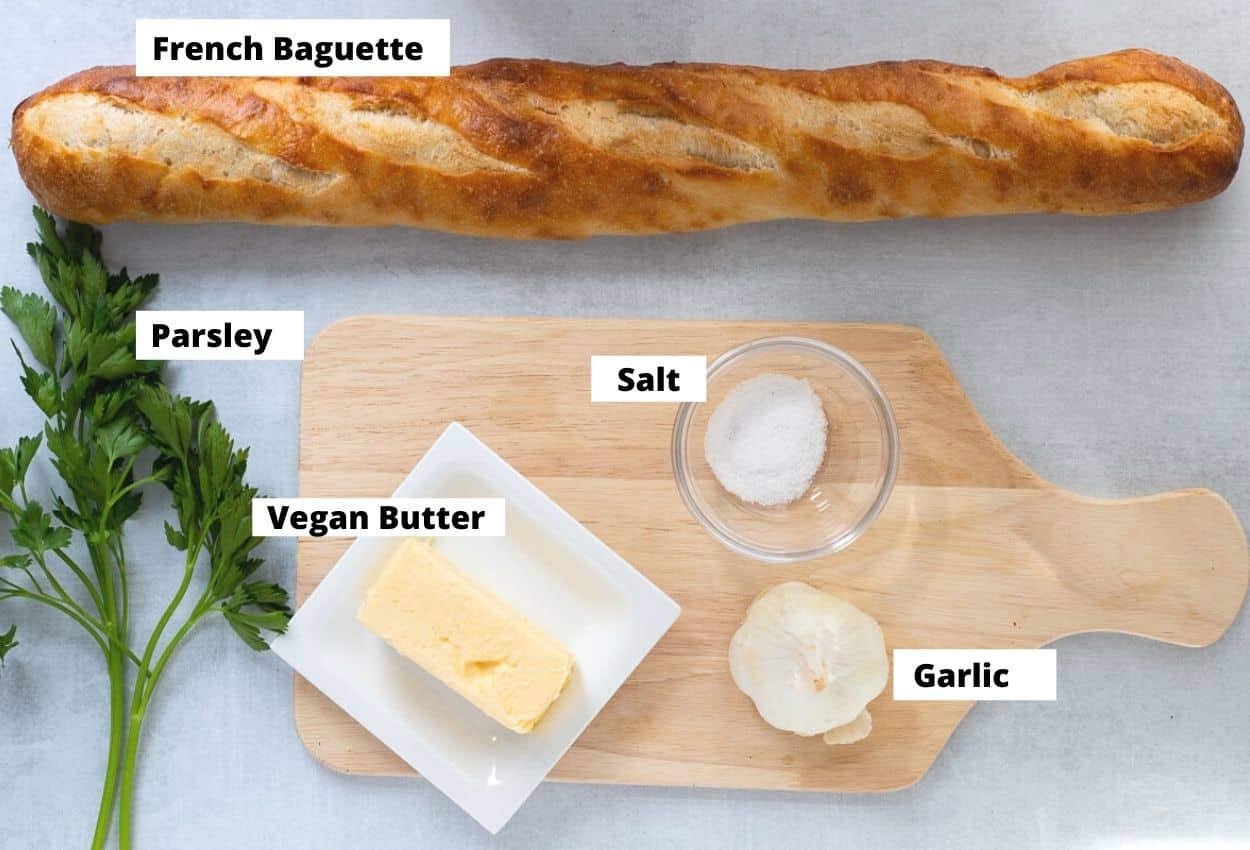 Ingredients for Vegan Garlic Bread: Parsley, baguette, vegan butter, salt, garlic head. 