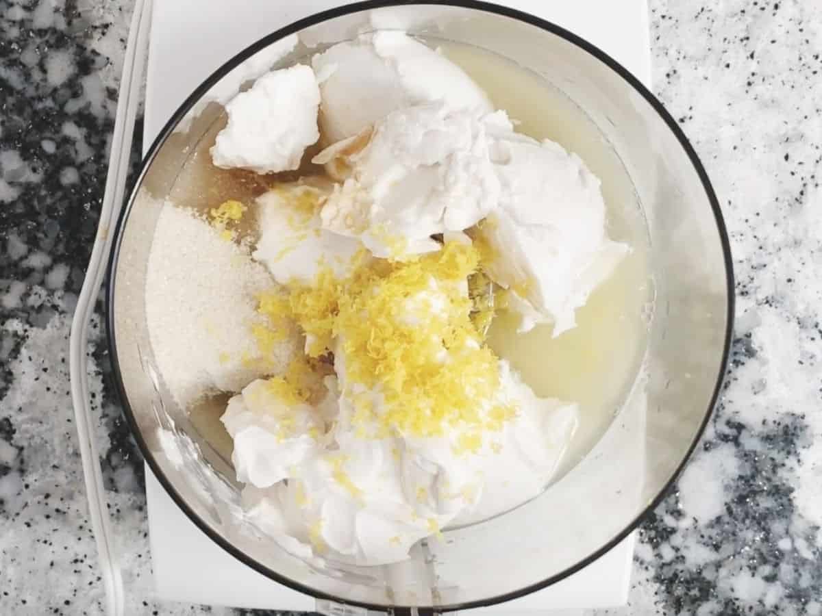 Cream cheese, lemon zest and lemon juice in food processor.