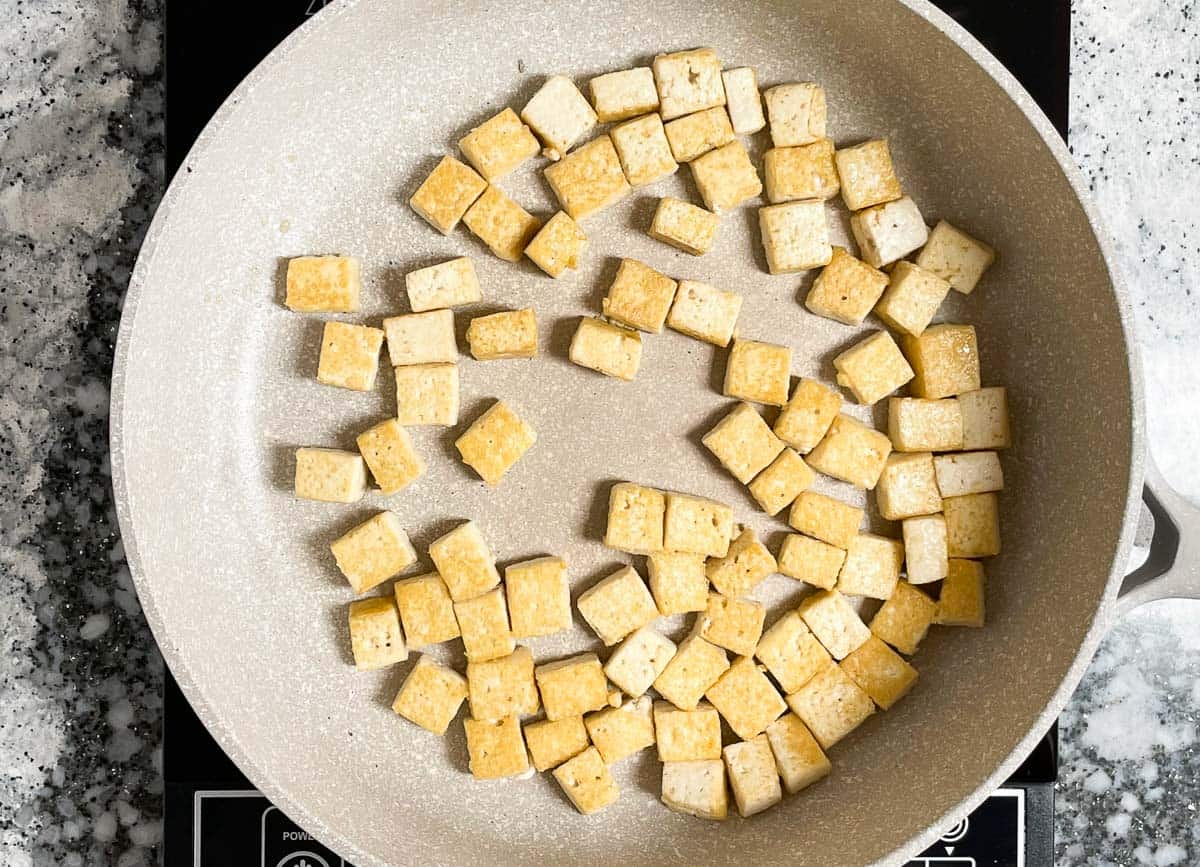 Crispy tofu in pan. 