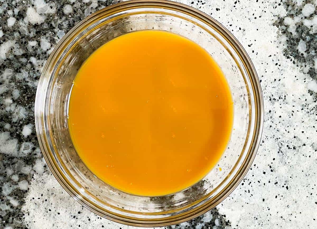 Orange sauce in glass bowl. 