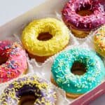 Box of colorful donuts.
