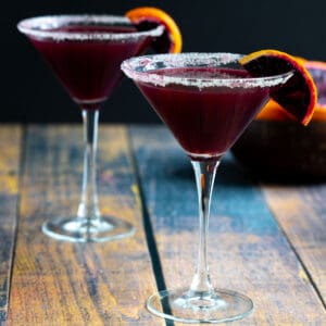 Two blood orange cocktails in martini glasses.