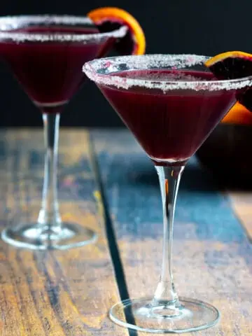 Two blood orange cocktails in martini glasses.