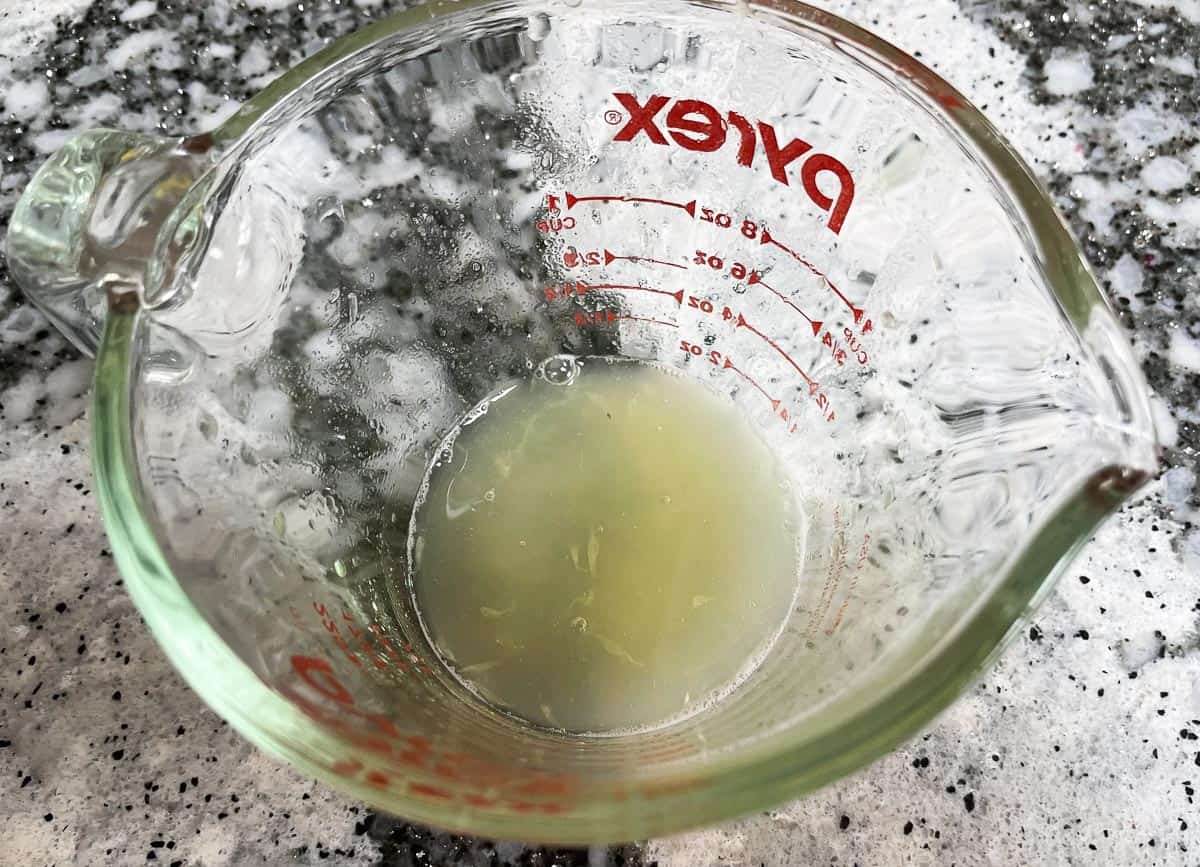 Lime juice in measuring cup. 