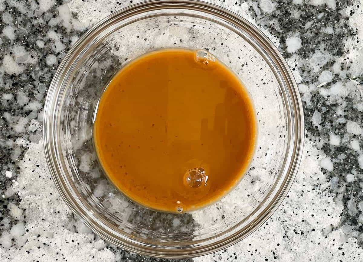 Szechuan sauce in small glass bowl. 