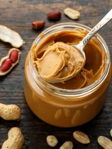 Peanut butter jar with spoon.