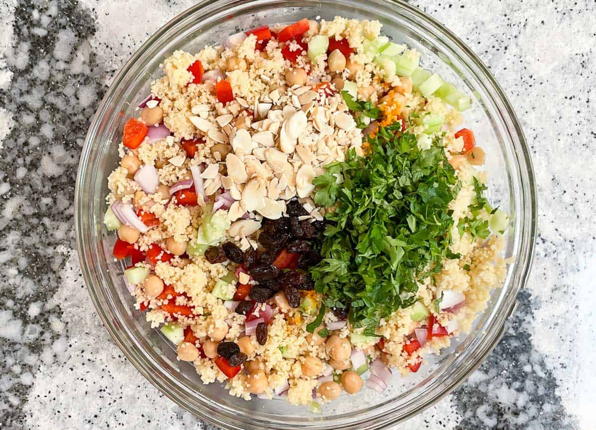 Couscous salad ingredients in large mixing bowl.