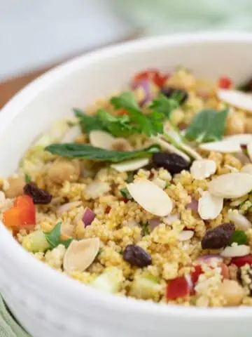 Couscous Moroccan Salad in white serving bowl.