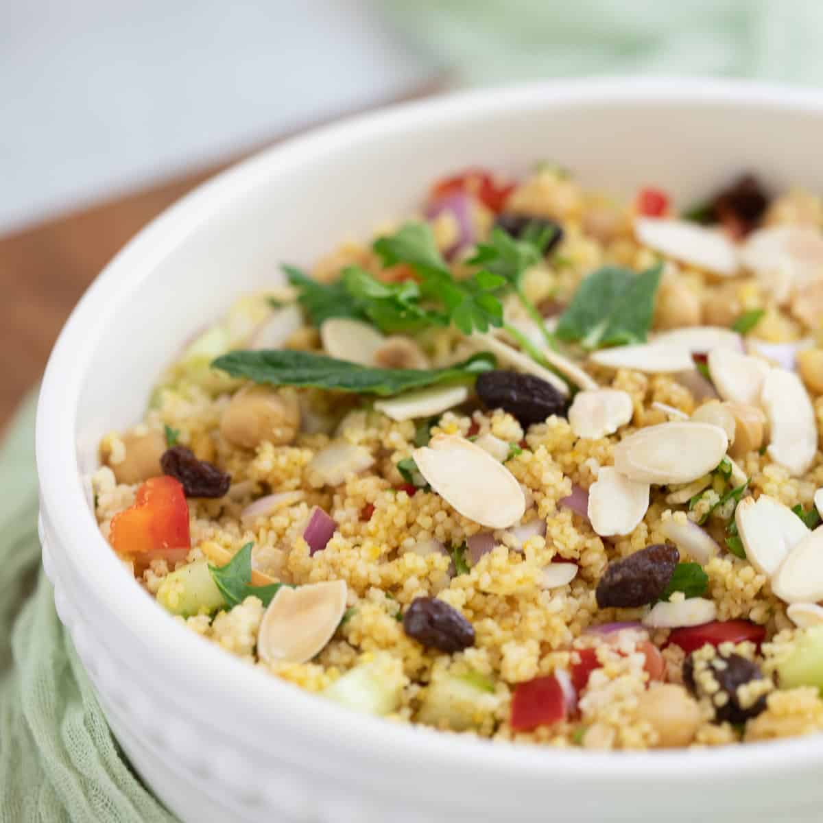 Couscous Moroccan Salad in white serving bowl.