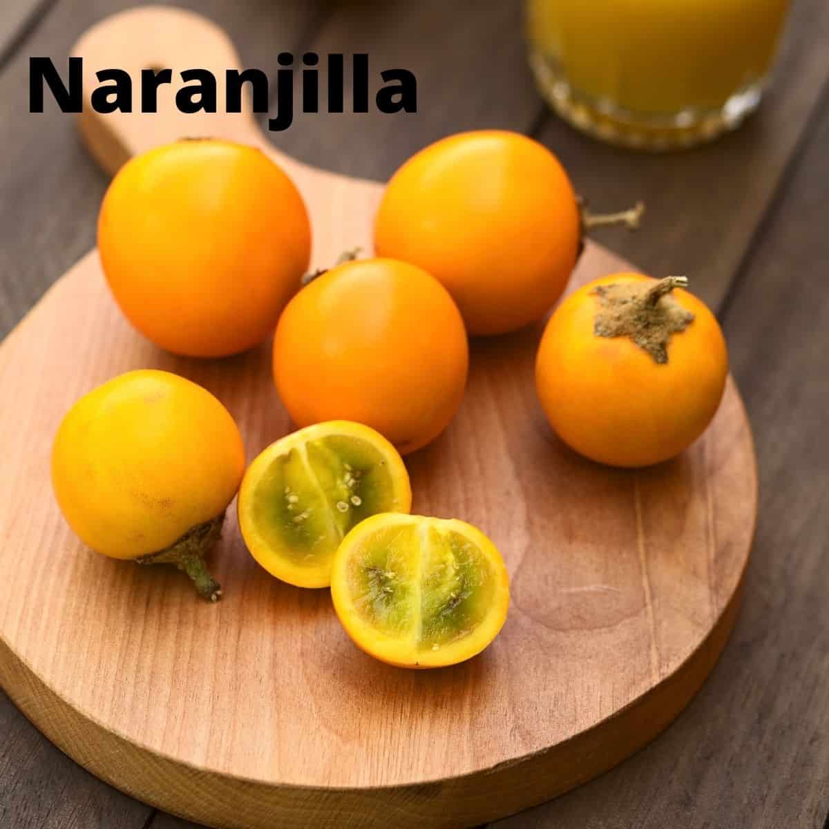 Naranjilla fruits on wood cutting board. 