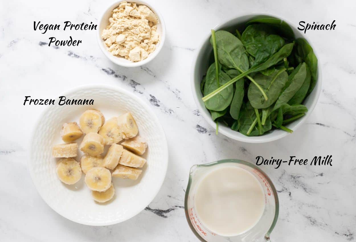 Vegan protein powder, spinach, dairy-free milk, frozen chopped banana. 