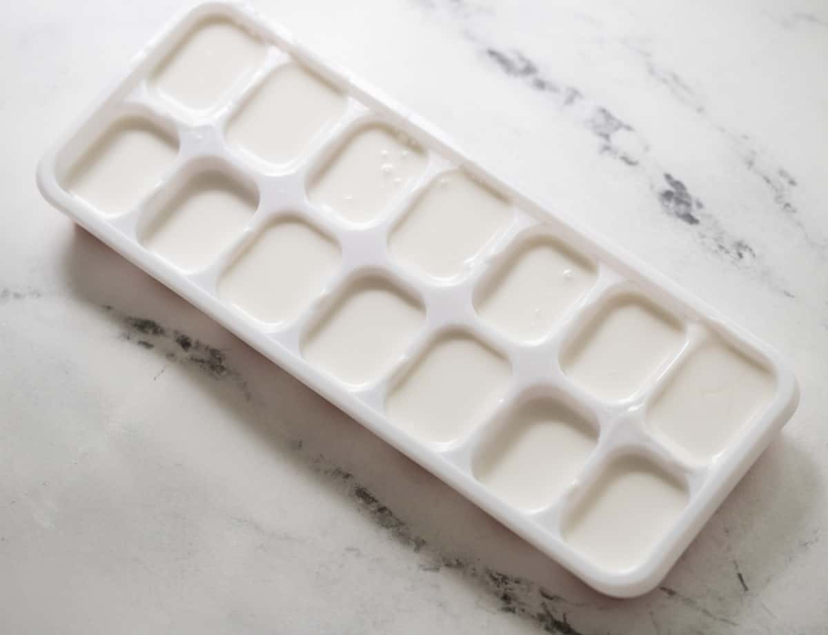 Coconut milk in ice tray.