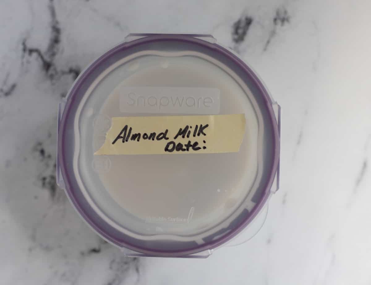 Glass container labeled "Almond Milk."
