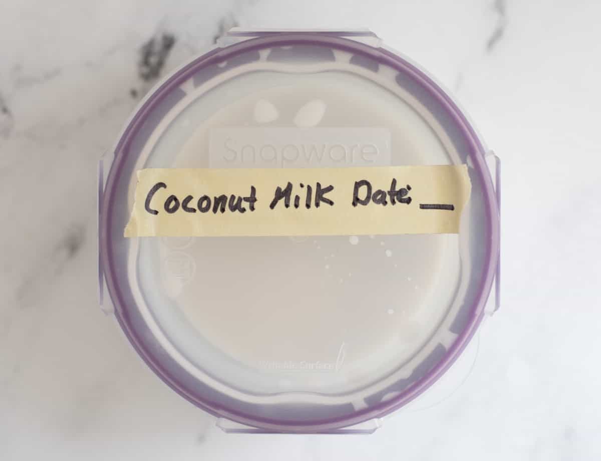 Labeled coconut milk in jar. 