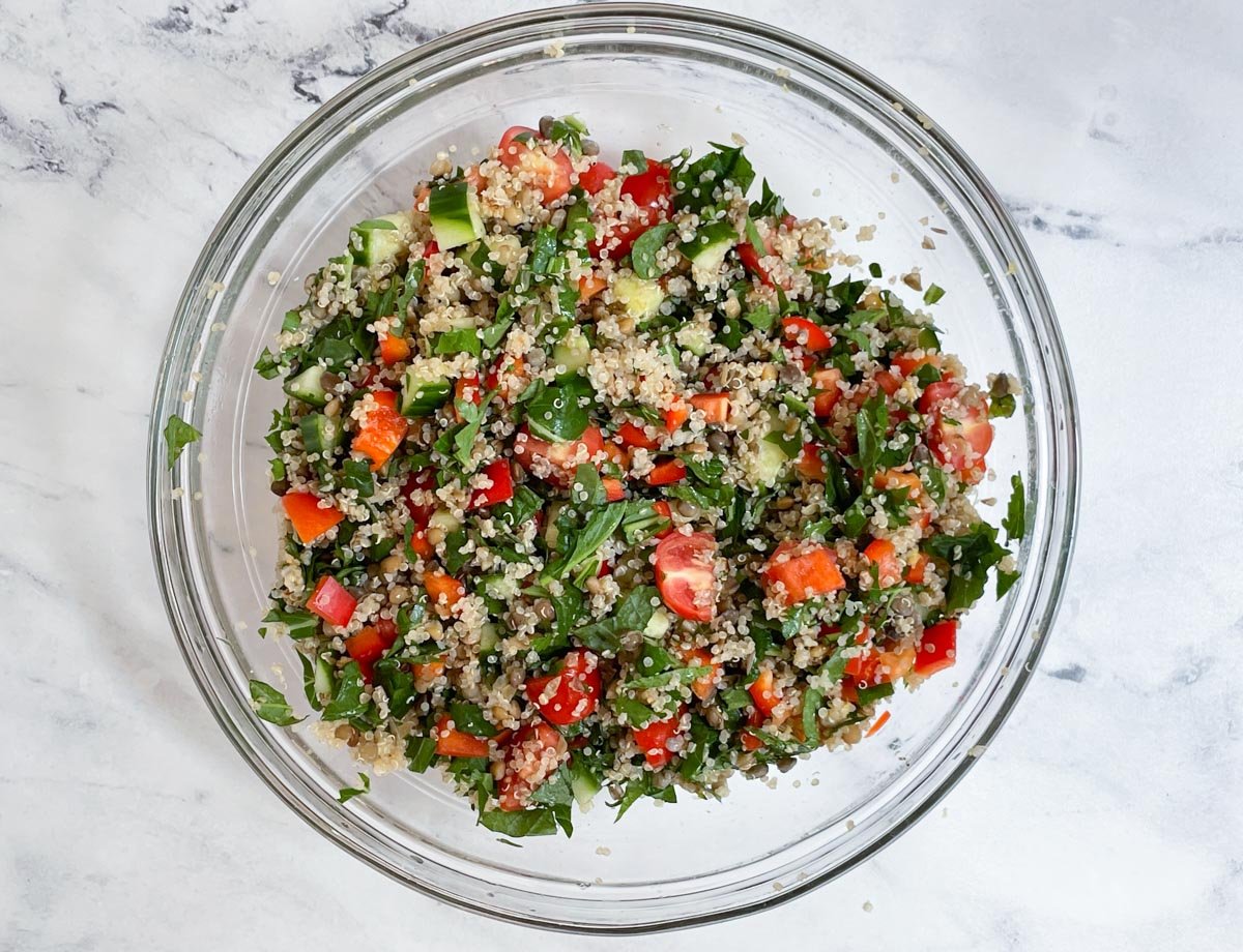 Quinoa salad with mixed vegetables in large bowl. 