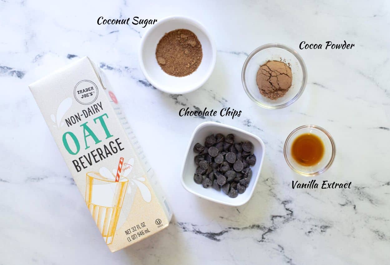 Ingredients for oat milk hot chocolate: oat milk, coconut sugar, chocolate chips, cocoa powder, vanilla extract.