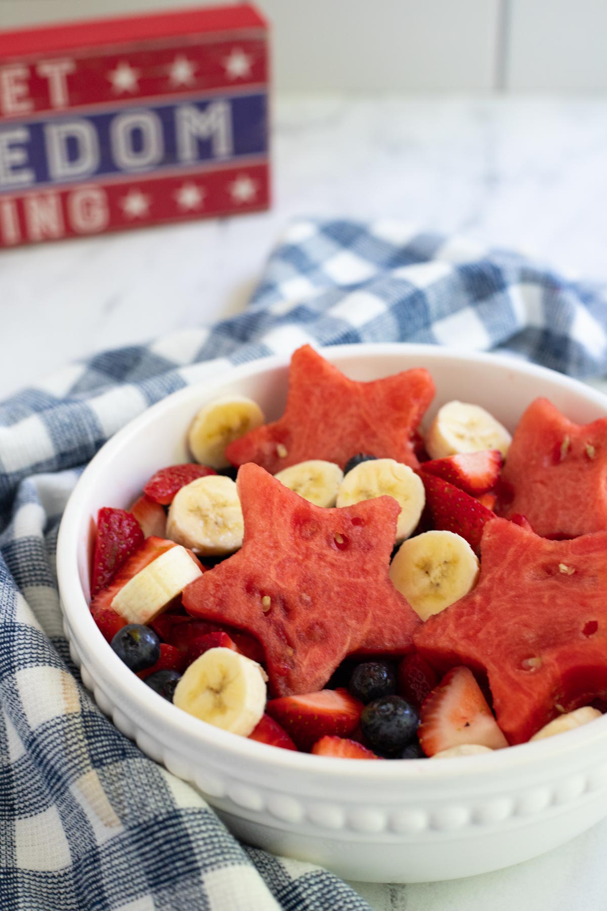 Strawberry, blueberry fruit salad with sliced bananas and watermelon stars. 
