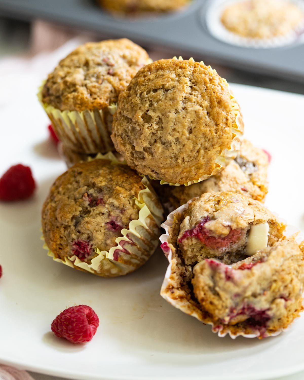 Vegan raspberry muffins on plate.