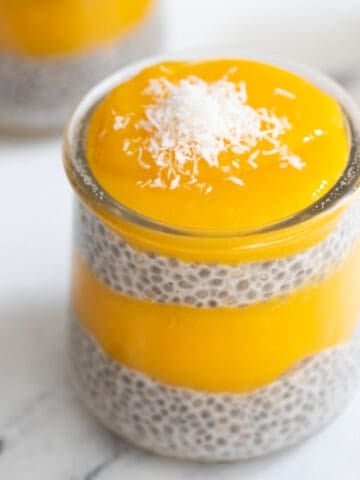 Cup of chia mango pudding. topped with coconut.