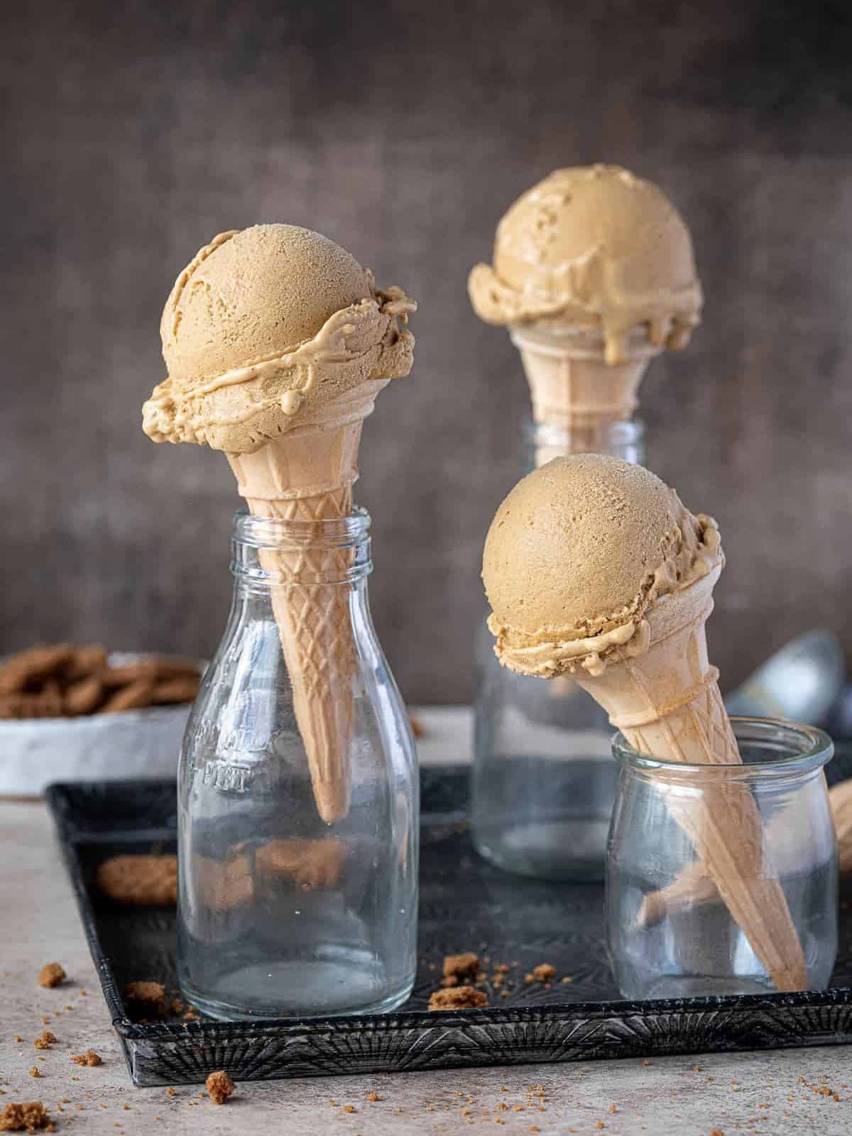 Pumpkin ice cream in ice cream cones. 