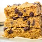 Vegan blondies stacked on top of one another.