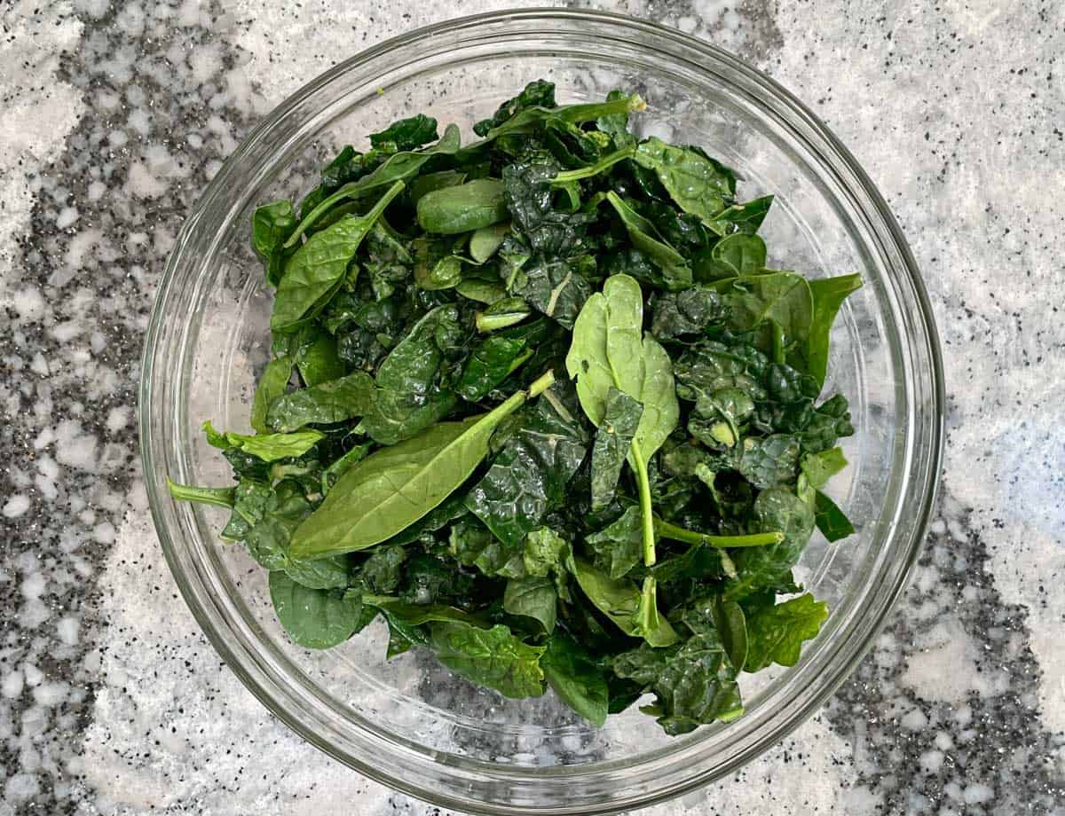 Dressed kale and spinach leaves.
