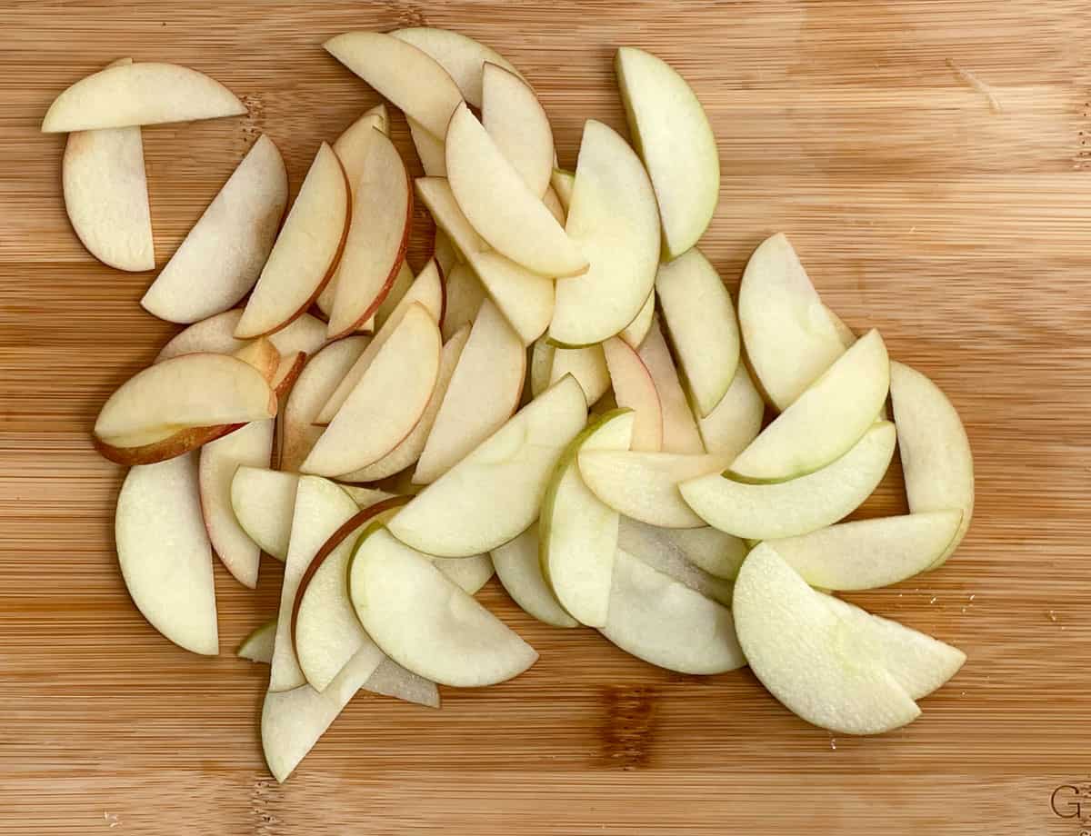 Apple slices on a cutting board.
