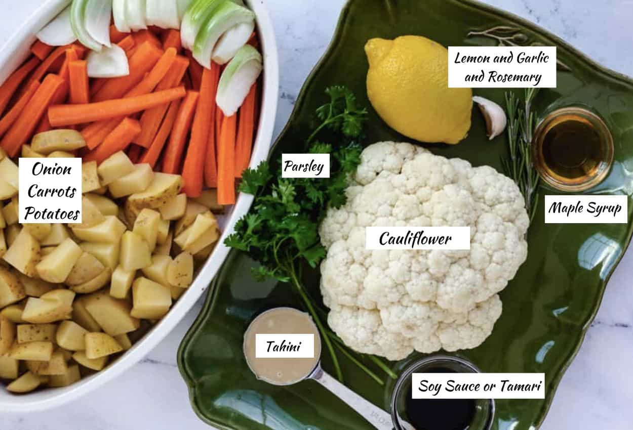 Ingredients for roasted cauliflower: cauliflower, tahini, soy sauce, maple syrup, rosemary, lemon, garlic, parsley, diced potatoes, carrots, leeks.
