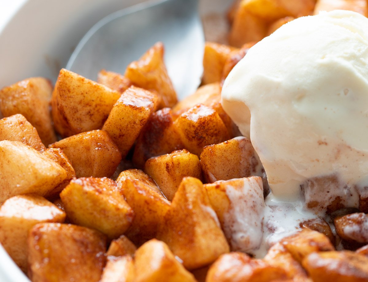 Air fryer apples in cinnamon served with vanilla ice cream
