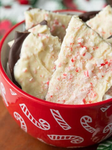 Vegan peppermint bark in candy cane bowl.
