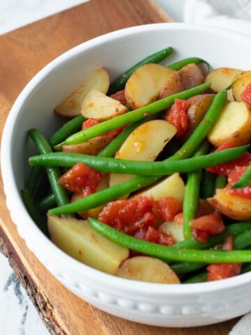 Potatoes and green beans in stewed tomatoes.