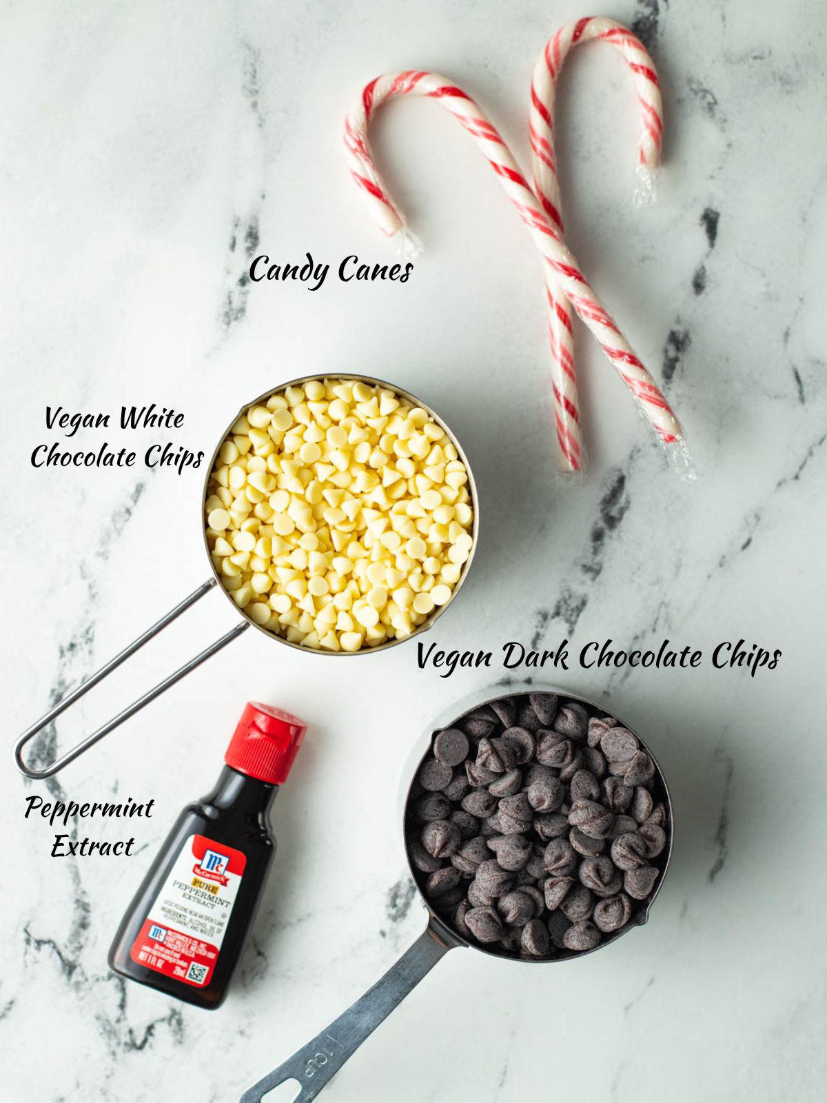Two candy canes, a cup of white chocolate chips, a cup of dark chocolate chips, peppermint extract.
