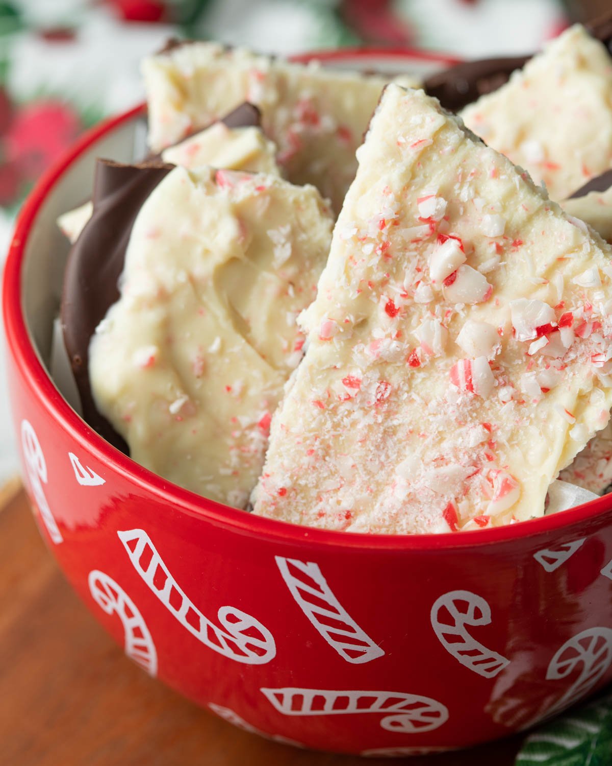 Vegan peppermint bark in candy cane bowl.