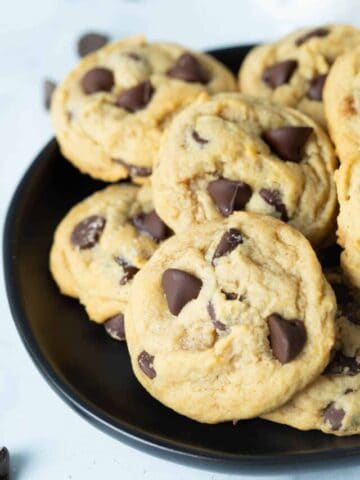 Eggless chocolate chip cookies on black plate