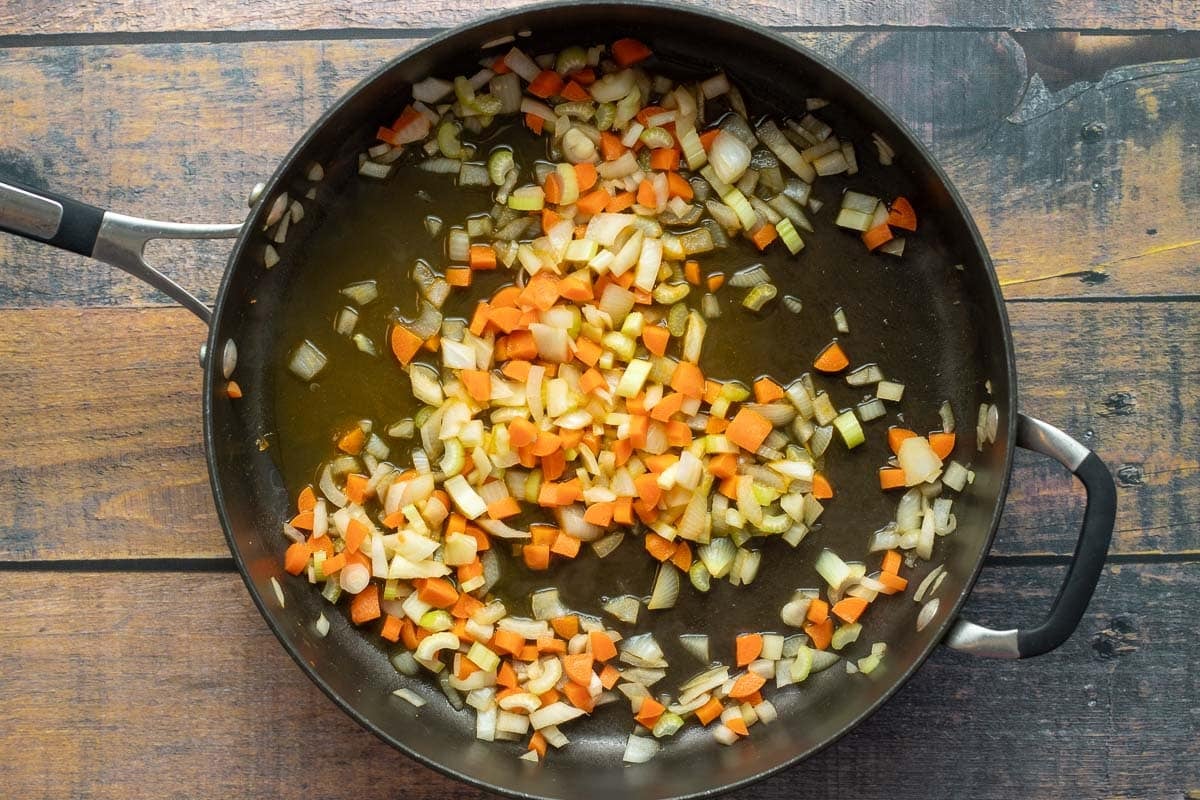 Onions, carrots, and celery in saute pan.
