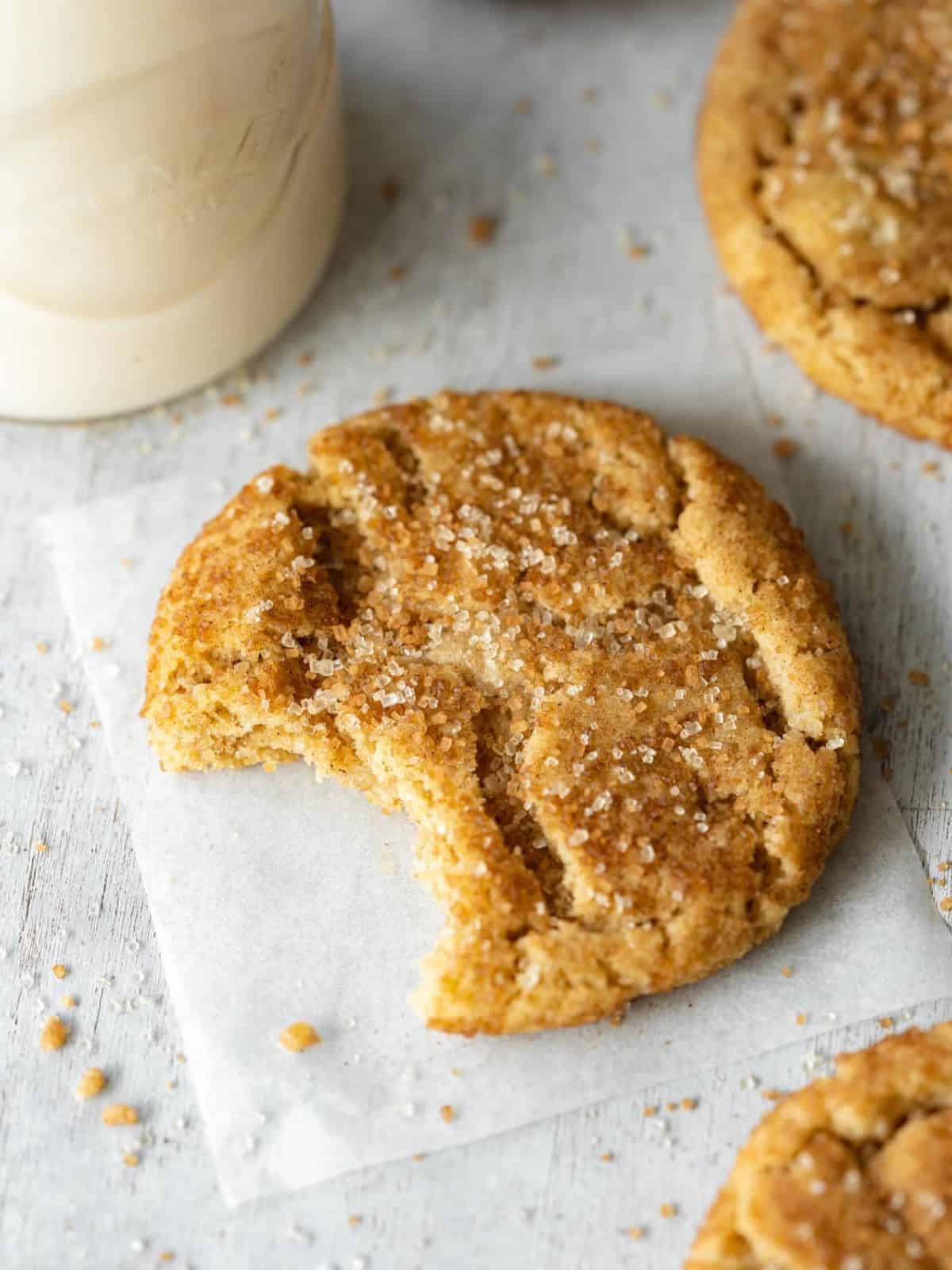 Snickerdoodle cookie with a bite taken out.
