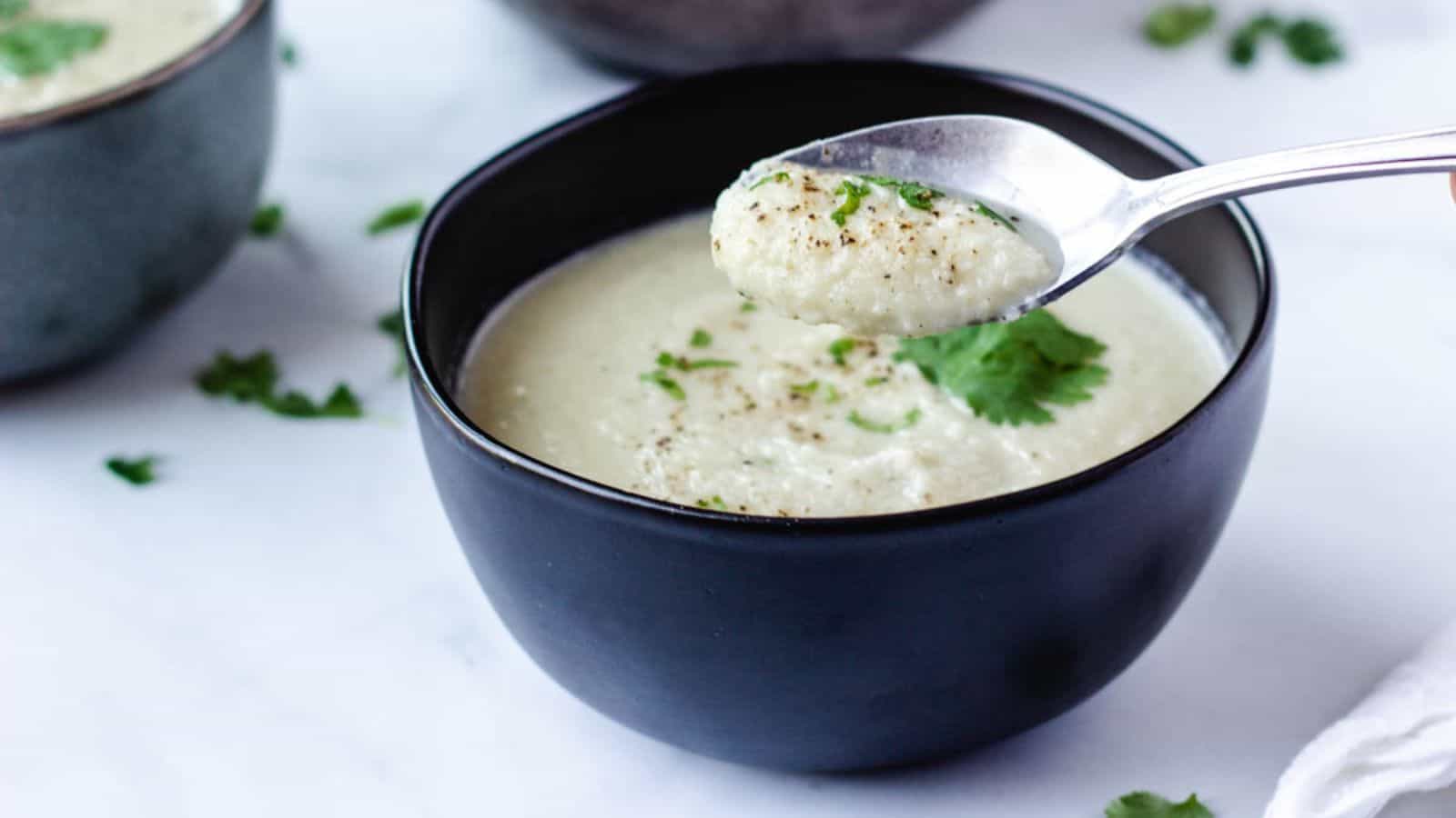 Bowl of vegan cauliflower soup.
