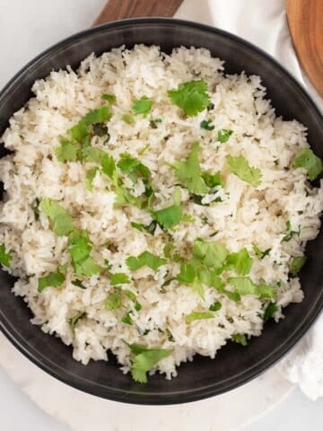 Cilantro lime rice in black bowl.