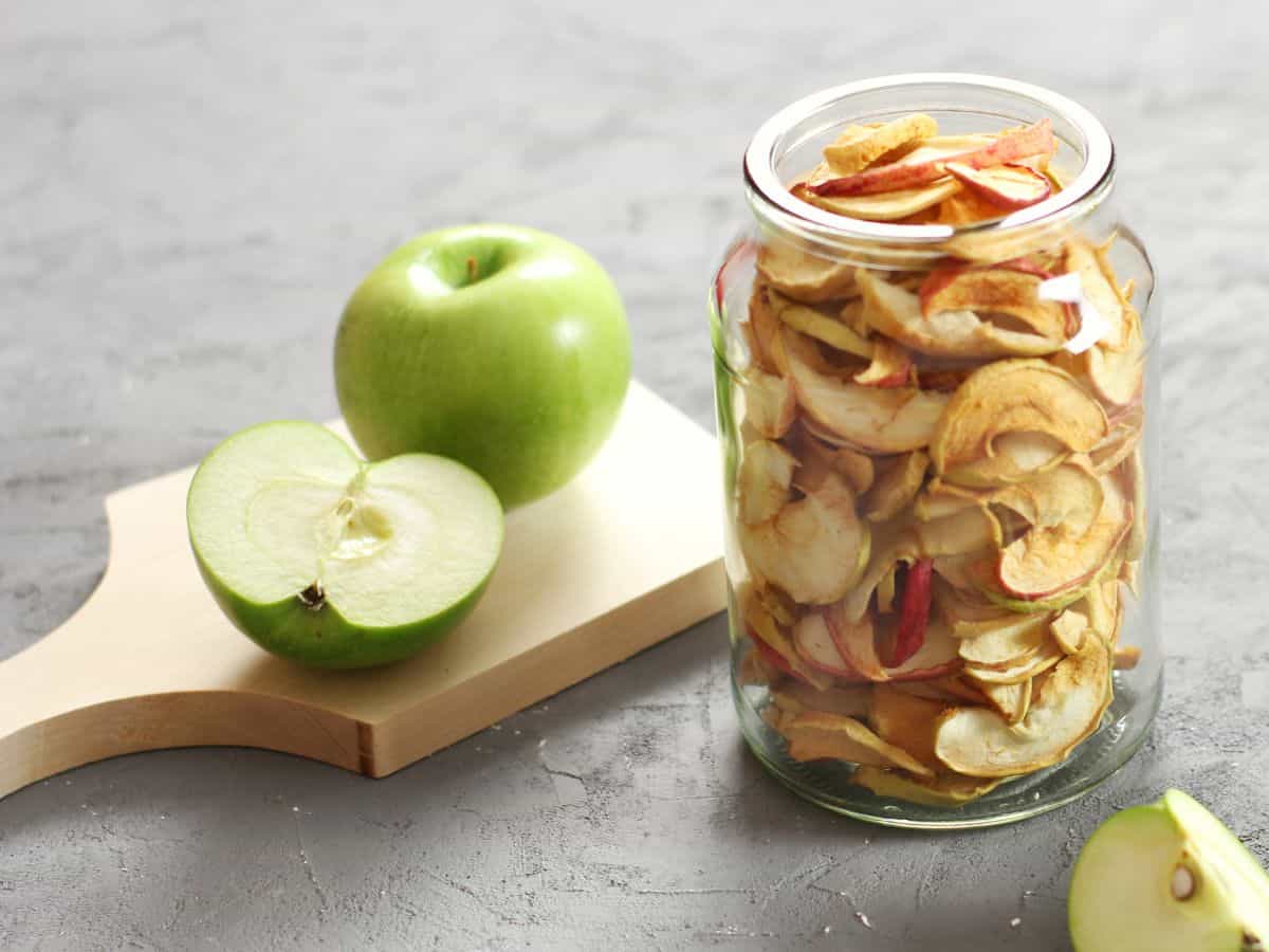Air fryer apples in a glass jar.
