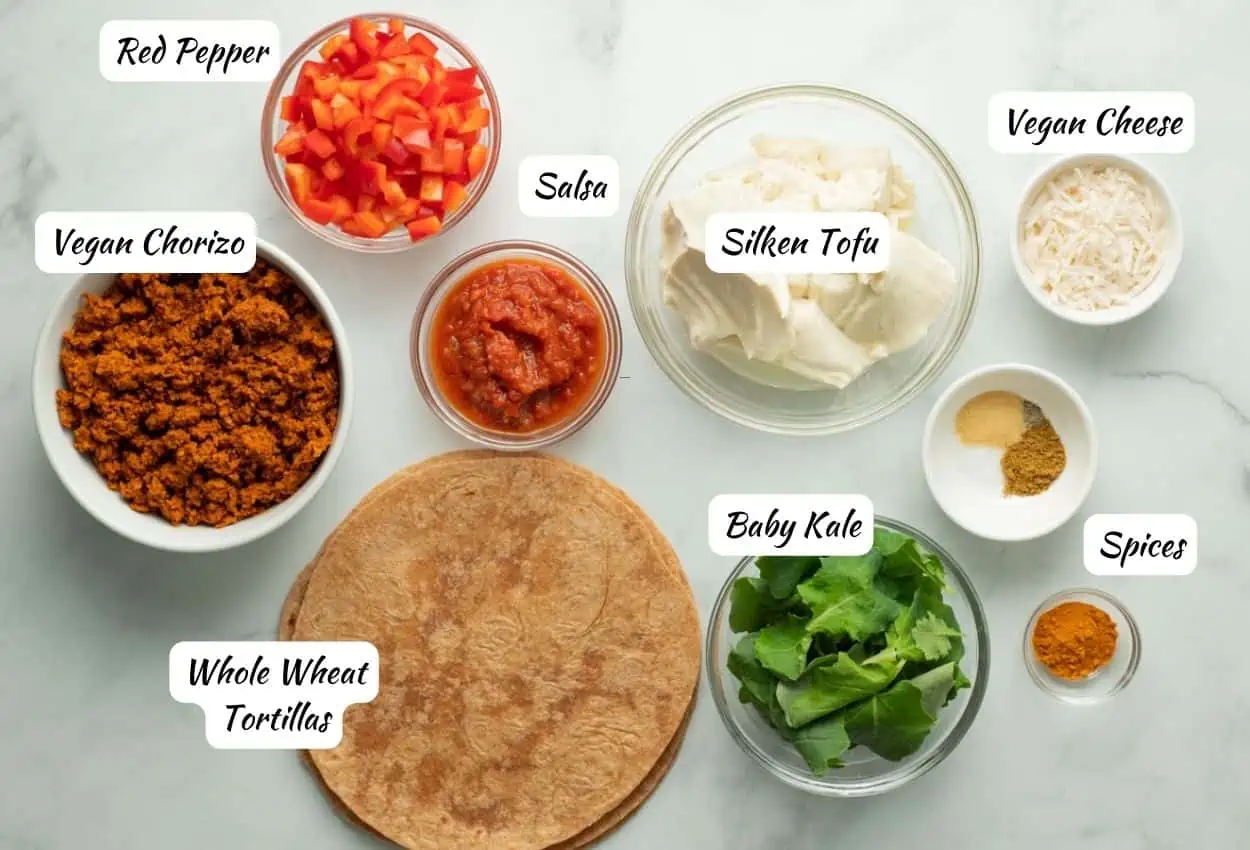 Vegan Breakfast Burrito Ingredients: diced red pepper, salsa, silken tofu, vegan cheese, spices, baby kale, whole wheat tortillas, vegan chorizo.
