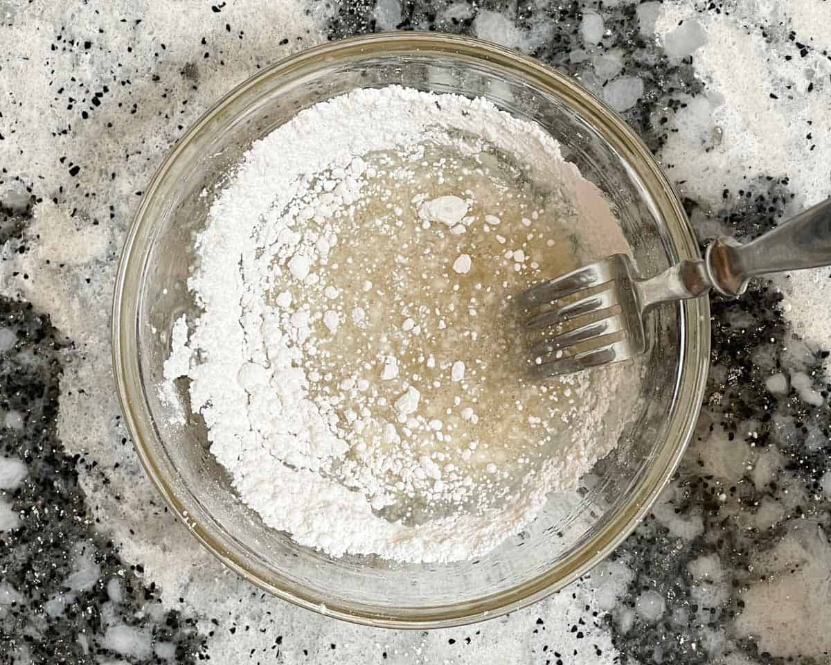 Lemon juice and powdered sugar whisked together with a fork.
