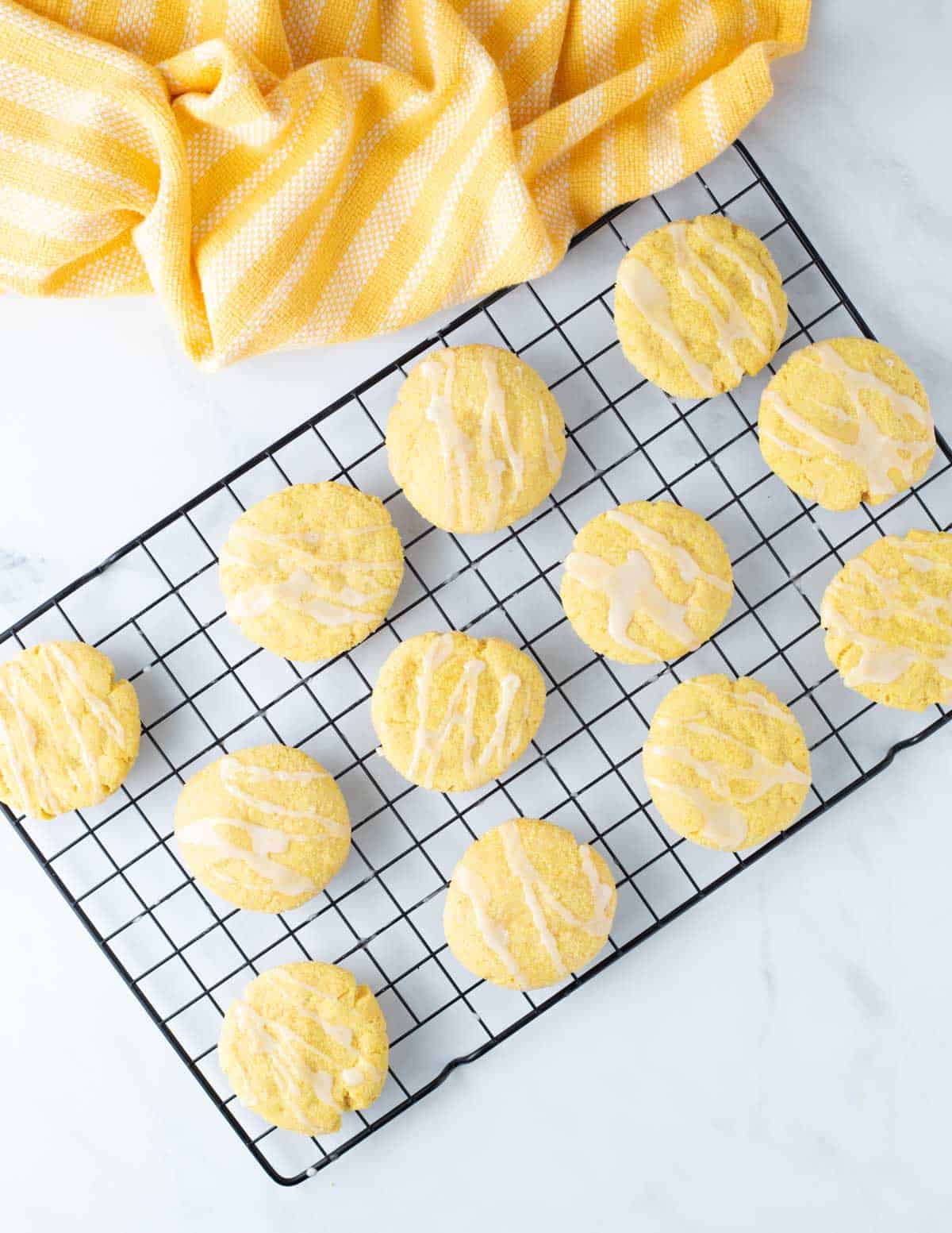 Vegan lemon cookies on cooling rack.
