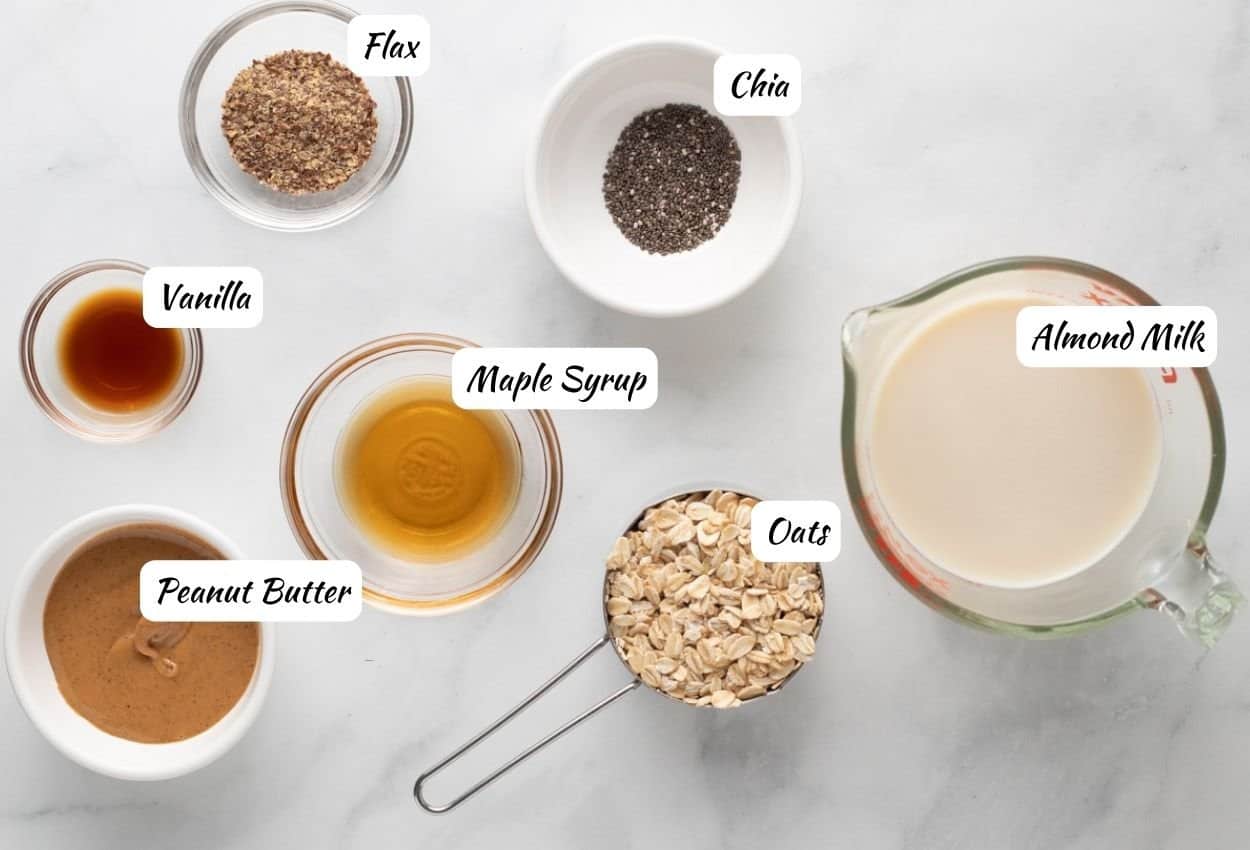 Peanut butter overnight oats ingredients: flax, chia, almond milk, oats, maple syrup, peanut butter, vanilla. 