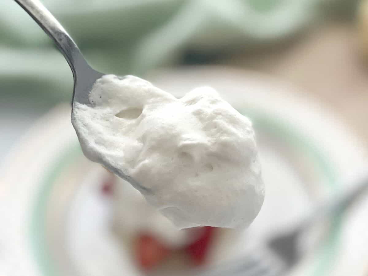 Whipped cream on a spoon.
